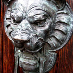 Lion door knocker outside apartment complex terrace. Canon EOS Rebel T3i. Lion door knocker outside apartment complex terrace. Canon EOS Rebel T3i.
