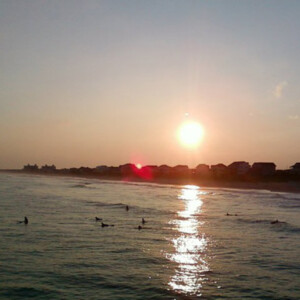 Sunset and surfers from the Atlantic Beach pier on Emerald Isle, NC. Canon PowerShot SX150 IS. Sunset and surfers from the Atlantic Beach pier on Emerald Isle, NC. Canon PowerShot SX150 IS.Sunset and surfers from the Atlantic Beach pier on Emerald Isle, NC. Canon PowerShot SX150 IS.