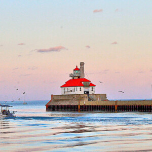 Outer breakwater lighthouse with a fishing charter boat heading out to sea at the Duluth-Superior canal. Canon EOS Rebel T3i. Outer breakwater lighthouse with a fishing charter boat heading out to sea at the Duluth-Superior canal. Canon EOS Rebel T3i.