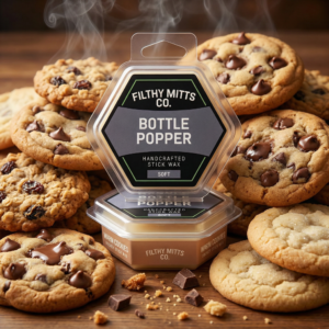 Actual photo of product with updated labeling/packaging processed through Kive.ai to generate realistic themed environment product images. Filthy Mitts Co. Bottle Popper Stick Wax