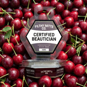 Actual photo of product with updated labeling/packaging processed through Kive.ai to generate realistic themed environment product images. Filthy Mitts Co. Certified Beautician Stick Wax