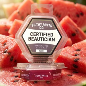 Actual photo of product with updated labeling/packaging processed through Kive.ai to generate realistic themed environment product images. Filthy Mitts Co. Certified Beautician Stick Wax