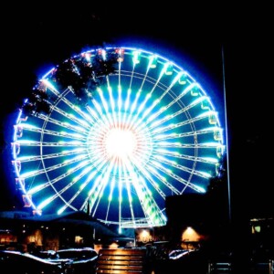 The Big Wheel at night with lights reflecting of the tractors on Machinery Hill. Canon EOS T3i. The Big Wheel at night with lights reflecting of the tractors on Machinery Hill. Canon EOS T3i.