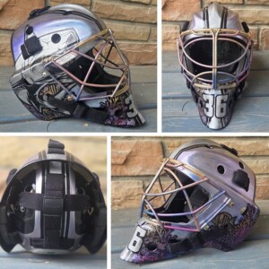 Chrome color powders used on a Bauer NME VTX goalie mask to create a shimmering underwater design. Backplate features a tribute to my mom and dada (their birth dates) and a player I coached who lost her life in a car accident. Chrome color powders used on a Bauer NME VTX goalie mask to create a shimmering underwater design. Backplate features a tribute to my mom and dada (their birth dates) and a player I coached who lost her life in a car accident.